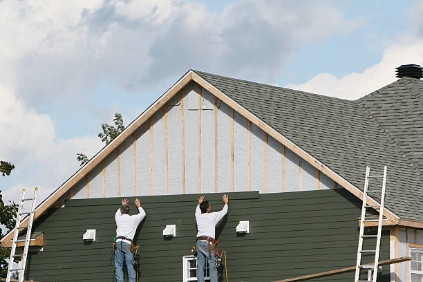 Professional Storm Damage Siding Repair technician working in Alberta, VA